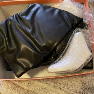 Thigh high black leather boots